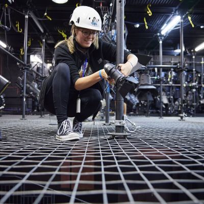 Participant on Production Arts course setting up lights